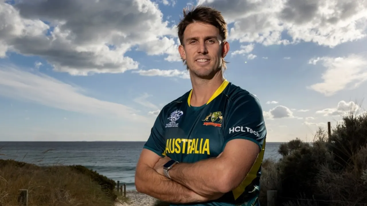Australian athlete in team jersey by the seaside.