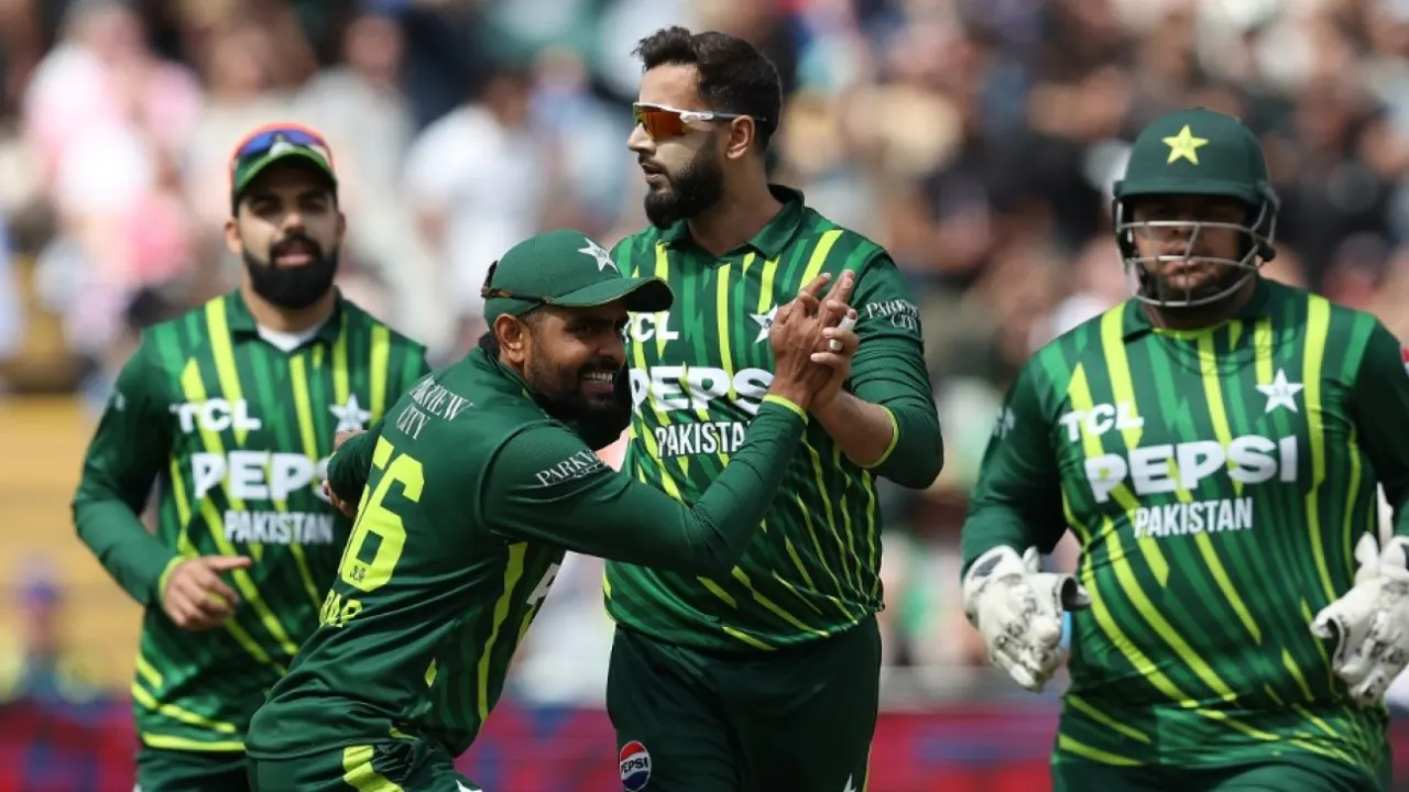 Pakistani cricketers celebrating during a match.
