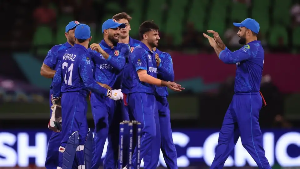 Afghanistan cricket team celebrating during a match.