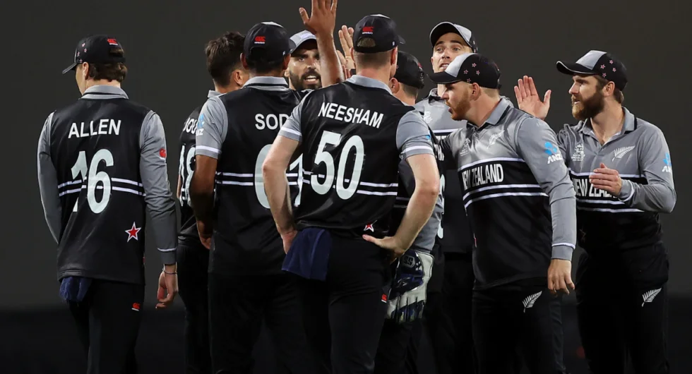 New Zealand cricket team celebrating during a match.