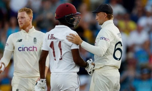 Cricket players interacting during a match.