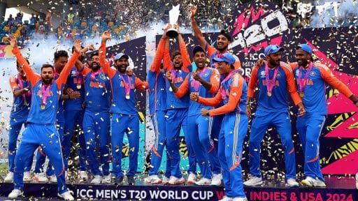 Indian cricket team celebrating victory with trophy and confetti