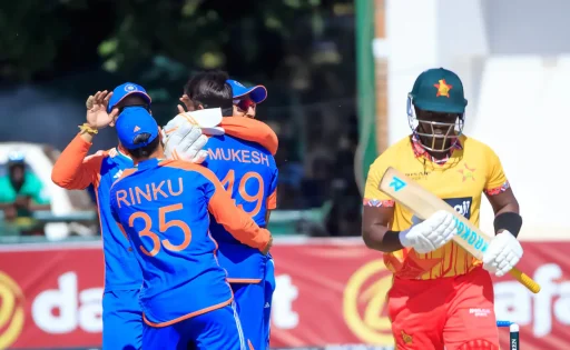 Cricket players celebrating wicket as batsman departs