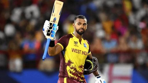 West Indian cricketer raising bat after scoring