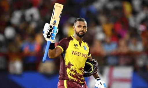 West Indian cricketer raising bat after scoring