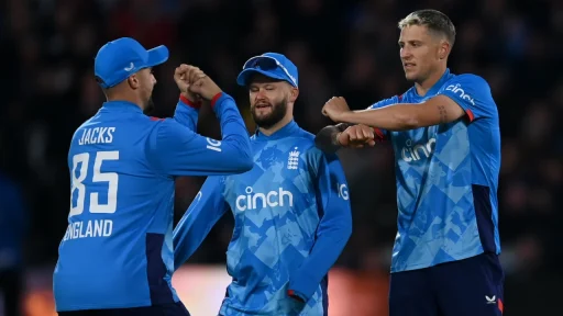 England cricket players celebrating during night match