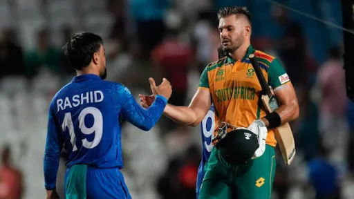 Cricketers from Afghanistan and South Africa shaking hands