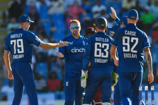 England cricket team strategizing during outdoor match