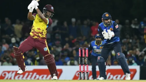 Cricket batsman playing a shot, wicketkeeper in action.