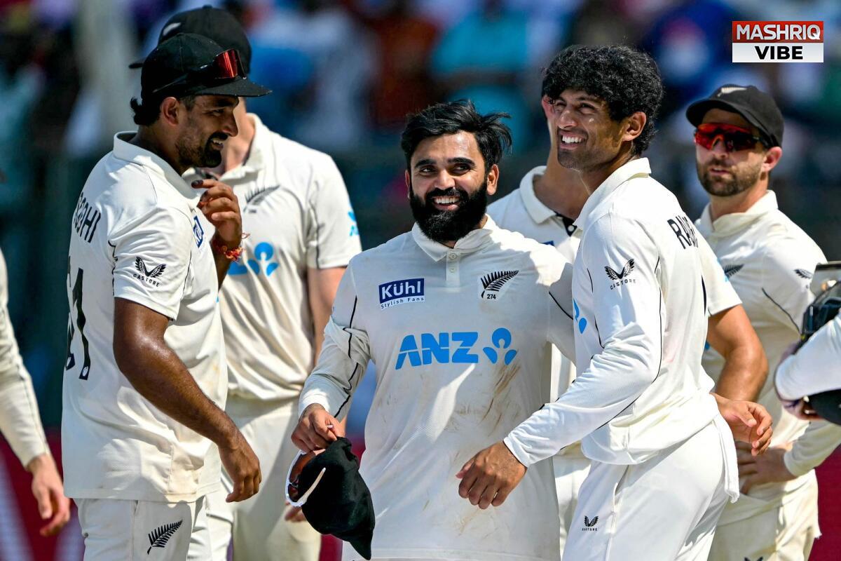 Cricket players celebrating during a sunny match day