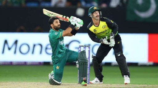 Pakistani batsman plays shot against Australian wicketkeeper