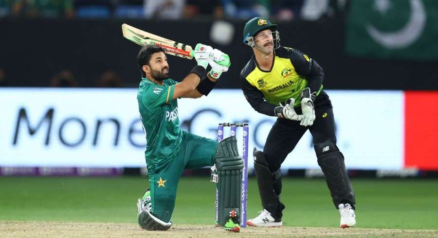 Pakistani batsman plays shot against Australian wicketkeeper