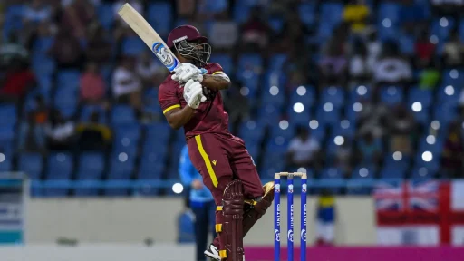 Cricketer playing shot at night match