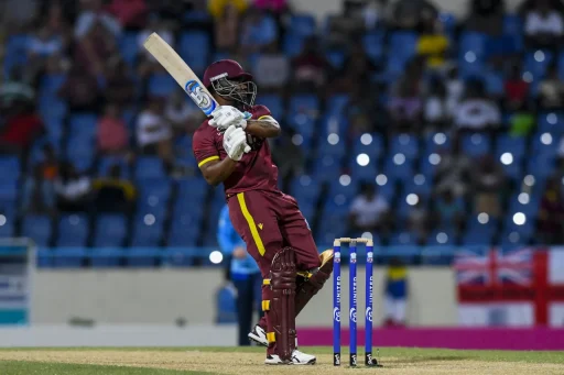 Cricketer playing shot at night match