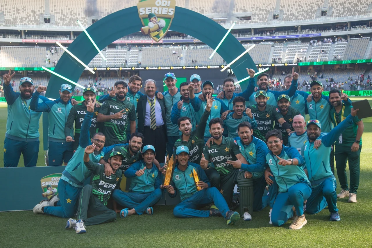 Cricket team celebrating victory at stadium