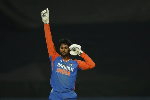 Indian cricketer celebrates victory at night match