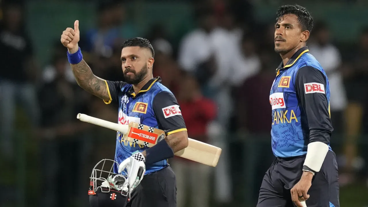 Cricket players celebrating during a night match