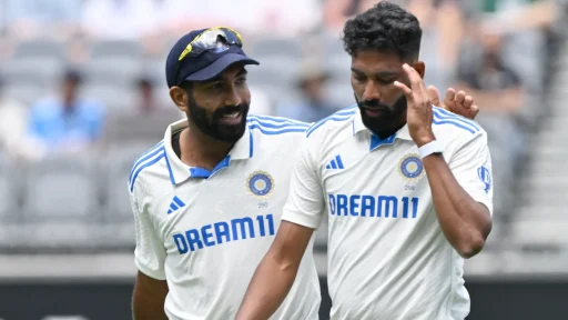 Two cricketers discussing tactics on field