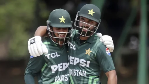 Two Pakistani cricketers celebrating on field