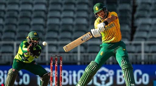 Cricket player hitting ball during match