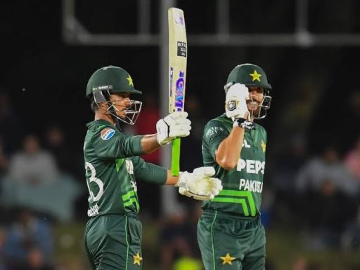 Pakistani cricketers celebrating during a night match