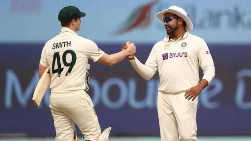 Cricketers shaking hands on the field