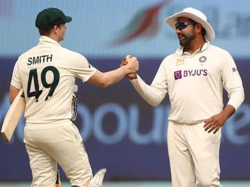 Cricketers shaking hands on the field