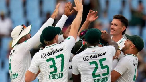 Cricket team celebrating victory with high-fives