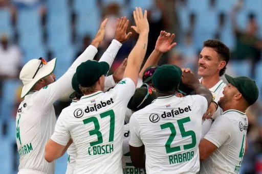 Cricket team celebrating victory with high-fives