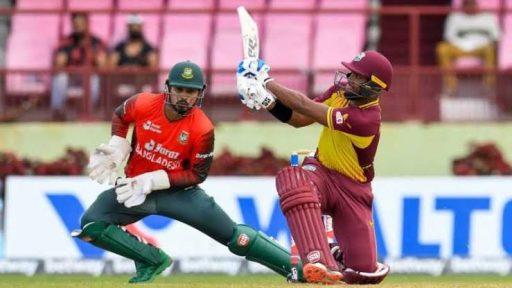 Cricket player hitting ball during a match