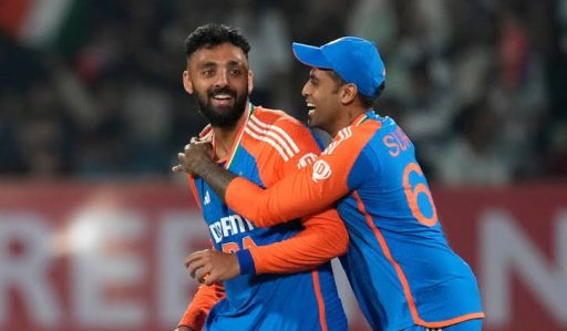 Two cricket players celebrating victory on field