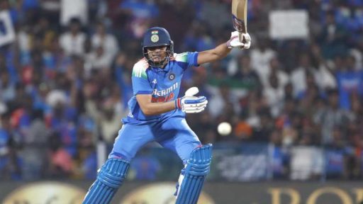 Cricketer playing a shot during a night match