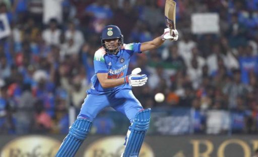 Cricketer playing a shot during a night match