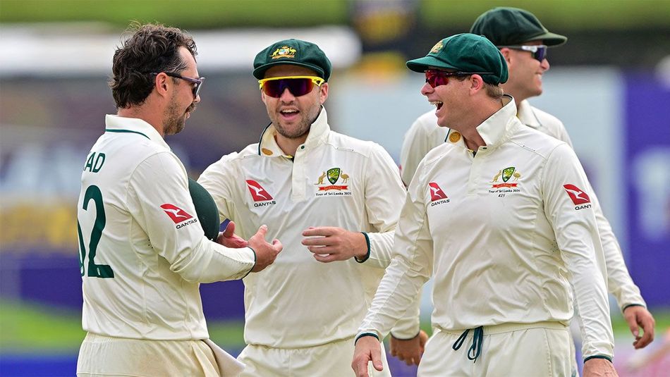 Australian cricketers celebrating on the field