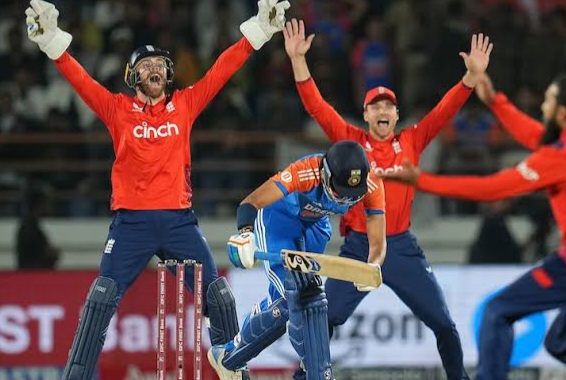 Cricket players celebrating during a night match