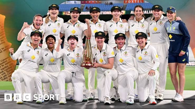 Australian women's cricket team celebrating trophy win